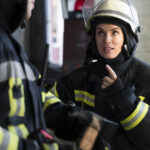 male-female-firefighters-working-together-suits-helmets