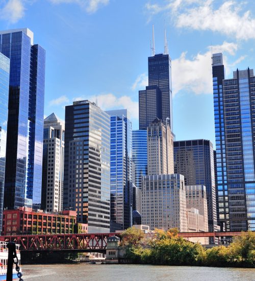 Chicago city downtown urban skyline with skyscrapers and cloudy blue sky.